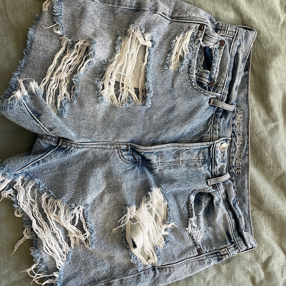 Brand new never worn American Eagle medium- light washed ripped jean shorts :)